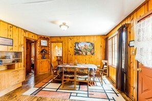 Enjoy meals in this inviting dining area with a large round table and comfortable seating.