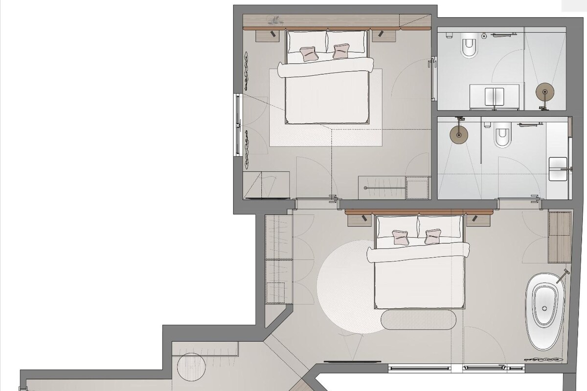 A floor plan of a hotel with two bedrooms, a bathroom, a kitchen, and a dining area.