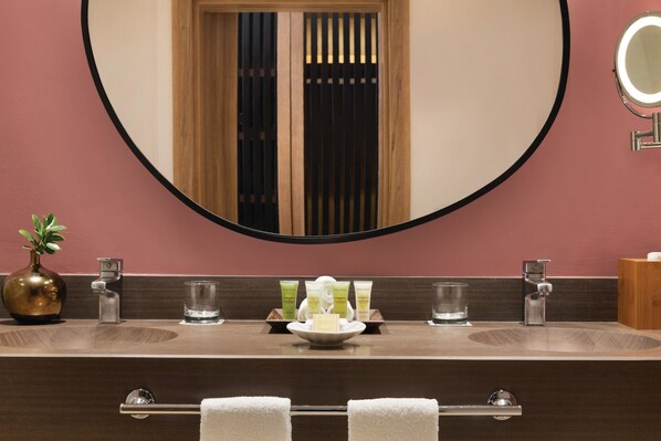 A bathroom with a large mirror, two sinks, a vanity, and a towel rack. - Secrets La Romana Resort & Spa - Adults Only - All Inclusive (San Rafael del Yuma)