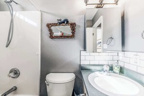 Bathtub, hair dryer, towels