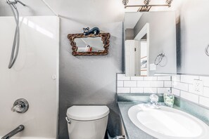 Bathtub, hair dryer, towels