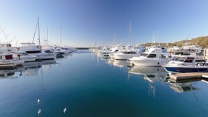 A marina with multiple yachts docked in calm waters. - Bayview Apartments, 11,42 Stockton Street - Three bedroom unit In the heart of town with air con, lift and secure parking (Nelson Bay)