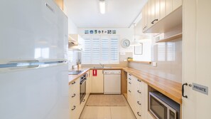Fridge, microwave, oven, stovetop - The Helm, 2/22 Voyager Cl - Stunning waterfront unit with Air Conditioning (Nelson Bay)
