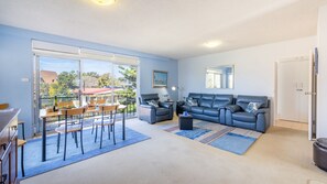 Living area - The Helm, 8/22 Voyager Close - hear the waves from Shoal Bay Beach (Nelson Bay)