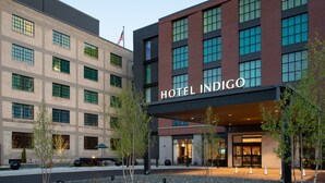 A hotel with a modern facade, large windows, and a prominent entrance. - Hotel Indigo Madison Downtown by IHG (Madison)
