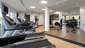 A gym with treadmills, elliptical machines, and weight equipment. - Holiday Inn & Suites Savannah Airport - Pooler by IHG (Pooler)