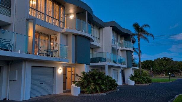 A modern multi-story residential building with balconies, a garage, and a landscaped driveway. - Barefoot, 7/44 Marine Drive - Fabulous Fingal Bay (Fingal Bay)