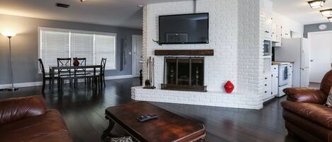 TV, fireplace, books