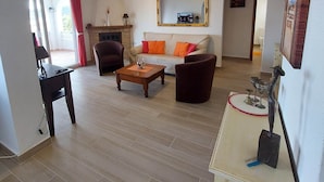 A living room with a sofa, armchairs, a coffee table, and a fireplace. - Magnificent villa with private swimming pool and breathtaking sea/mountain view  (Orba)