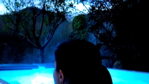A person sitting in a hot tub with a blue light. - Luxe studio Casa Angiz Etxea 2; charm, outdoor spa and valley views (Sunbilla)