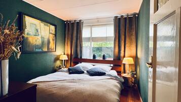 1 bedroom, desk, iron/ironing board, travel crib