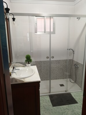 Shower, hair dryer, towels, soap