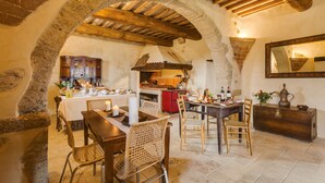 A rustic dining area with stone arches, wooden beams, and a stone fireplace. - VILLA WITH 6 APARTMENTS 23 SEATS BEDS (Radicondoli)