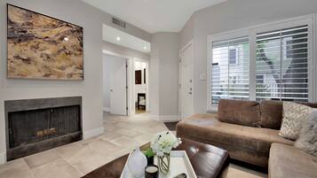 Smart TV, fireplace, books, offices