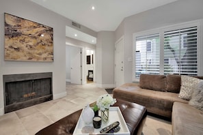 Smart TV, fireplace, books, offices