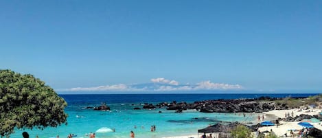 On the beach, sun loungers, beach towels