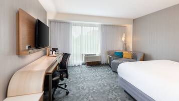 Premium bedding, desk, laptop workspace, iron/ironing board