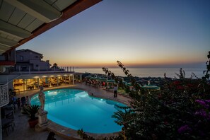 Seasonal outdoor pool, pool umbrellas, pool loungers