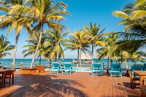 Outdoor dining - Oceanfront retreat with water view, pool, AC & free WiFi - easy beach access (Placencia)