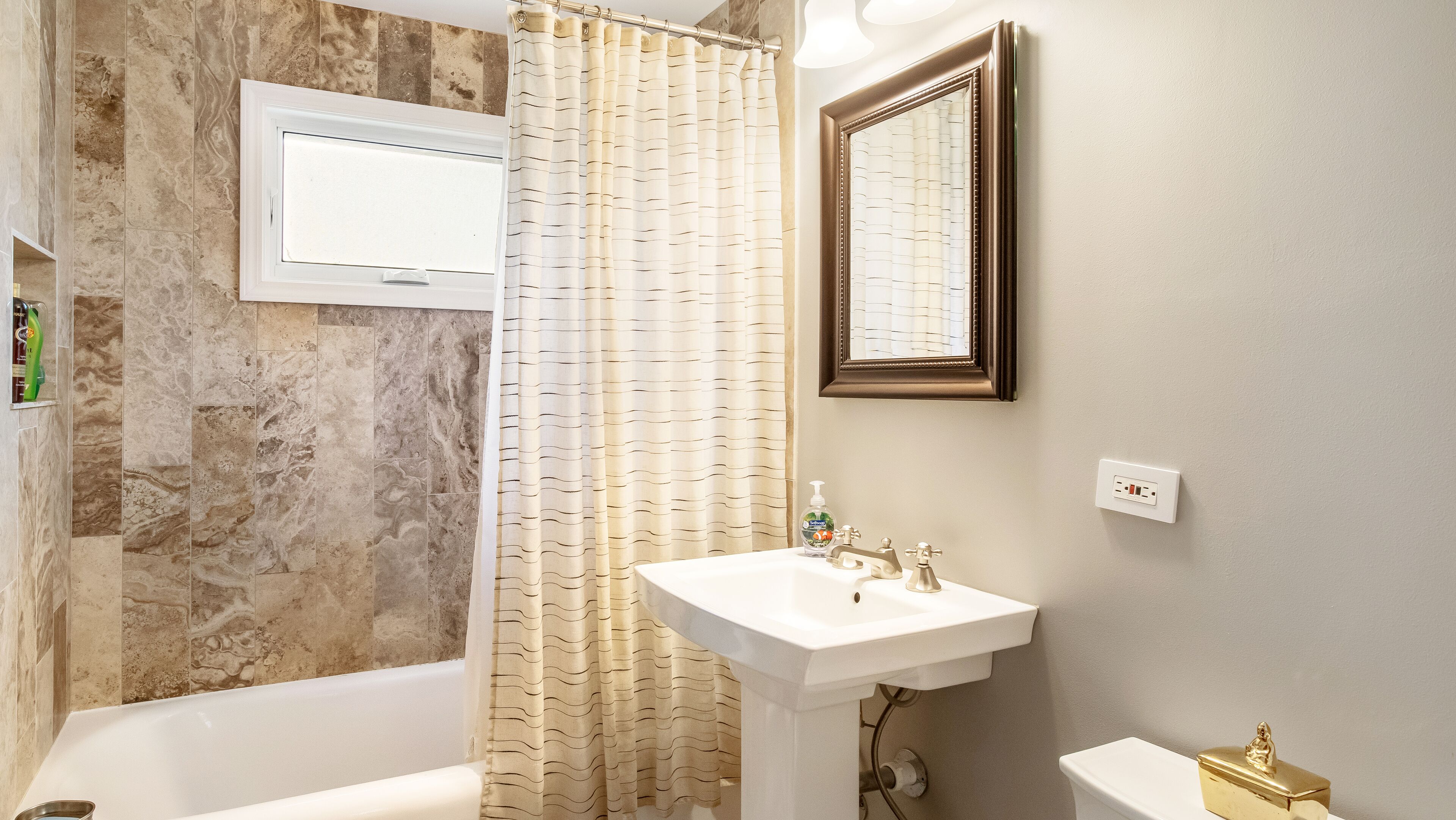 Bathtub, hair dryer, towels, soap