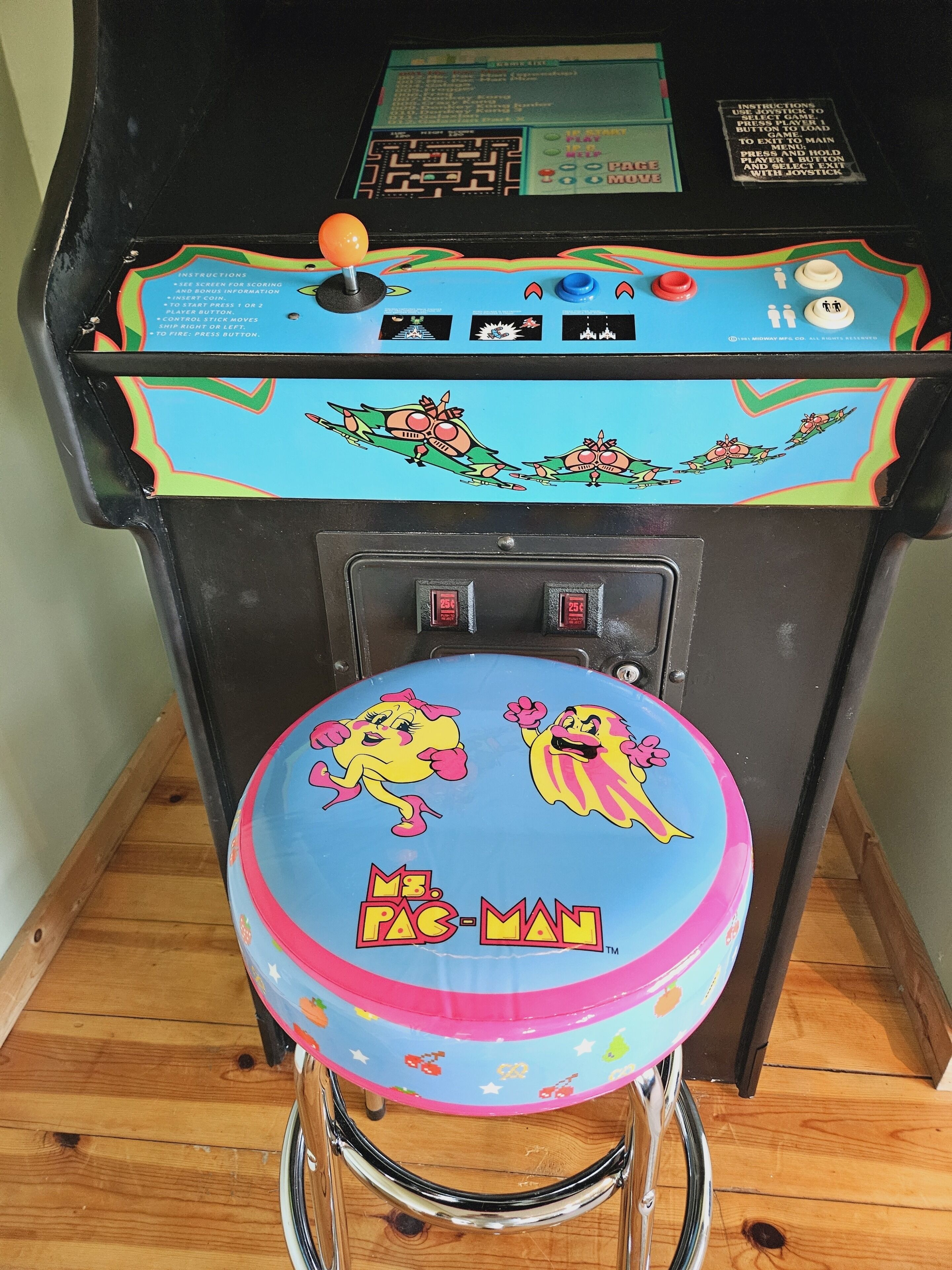 A vintage arcade machine with a colorful design and a joystick.