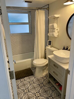 Combined shower/tub, hair dryer, towels, toilet paper