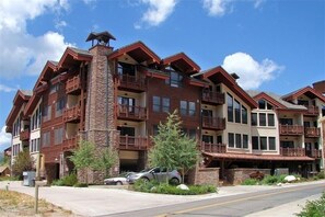 Experience the hotel's unique blend of stone and wood architecture, with spacious balconies on every level.
