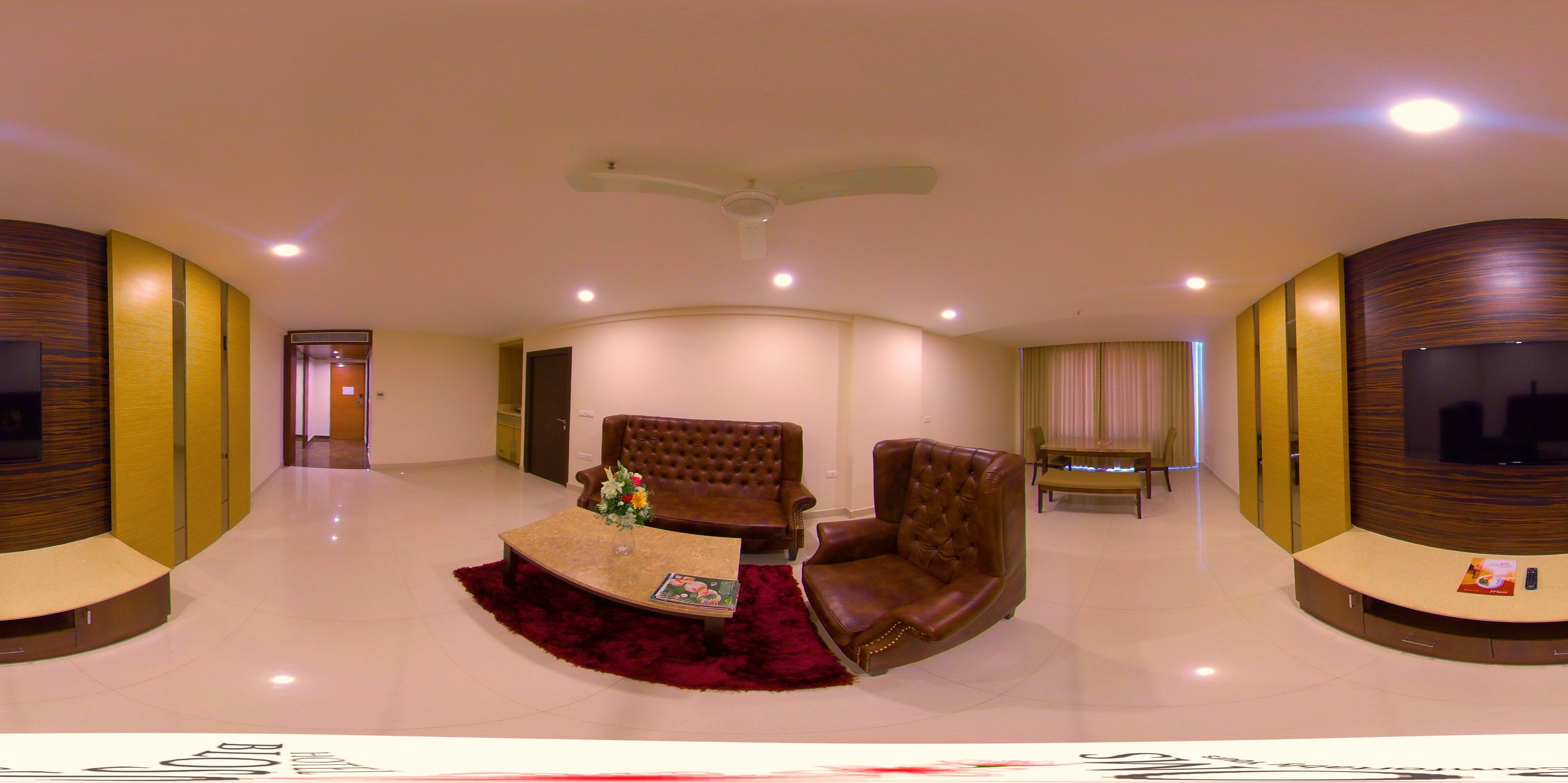 royal suite, 1 king bed, balcony, city view | living room | led tv, fireplace