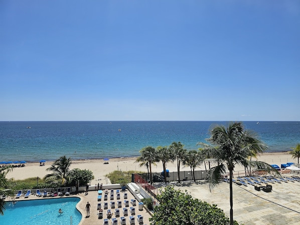On the beach, sun-loungers, beach towels
