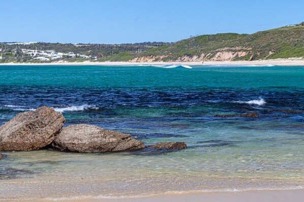 On the beach, sun-loungers