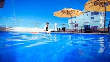 Outdoor pool, open 5:00 AM to 6:00 PM, pool umbrellas, pool loungers