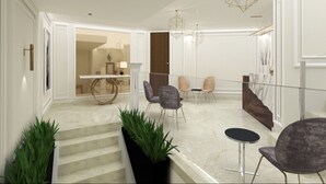 Un interior moderno con escalera, zona de estar e iluminación decorativa.