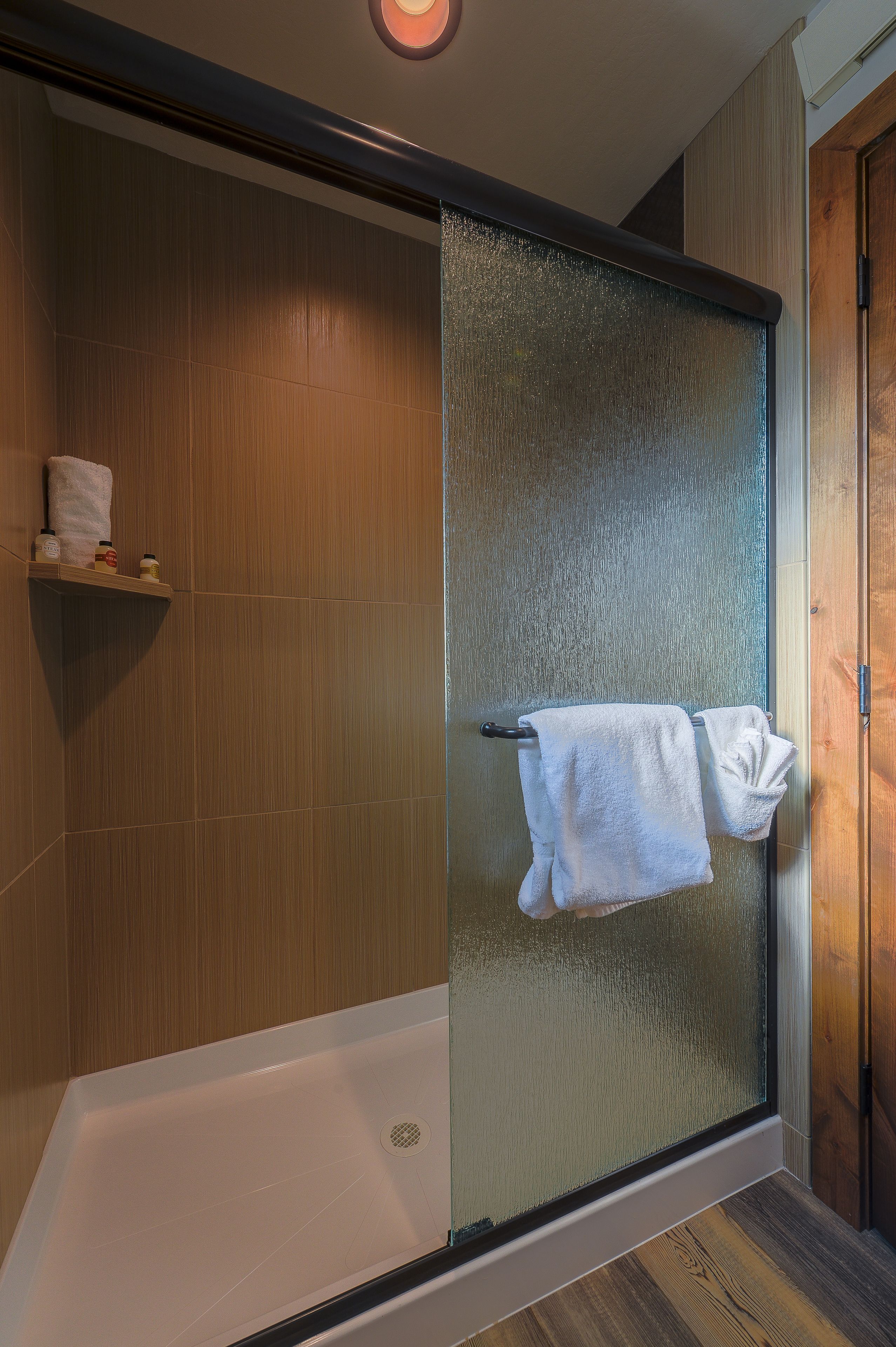 shower, bathrobes, slippers, towels