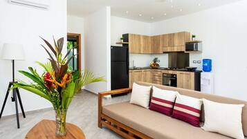 Apartment One Bedroom Pool or Garden View | Living room | Flat-screen TV