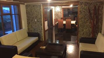 Standard Room, 1 Queen Bed, Non Smoking, Hill View | Living area | Fireplace