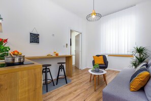 Appartement Deluxe, 1 grand lit et 1 canapé-lit, non-fumeur, coin cuisine | Coin séjour