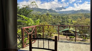 A balcony with a metal railing overlooking a mountainous landscape with lush greenery and a clear sky. - La Cantera Resort (Cajón)