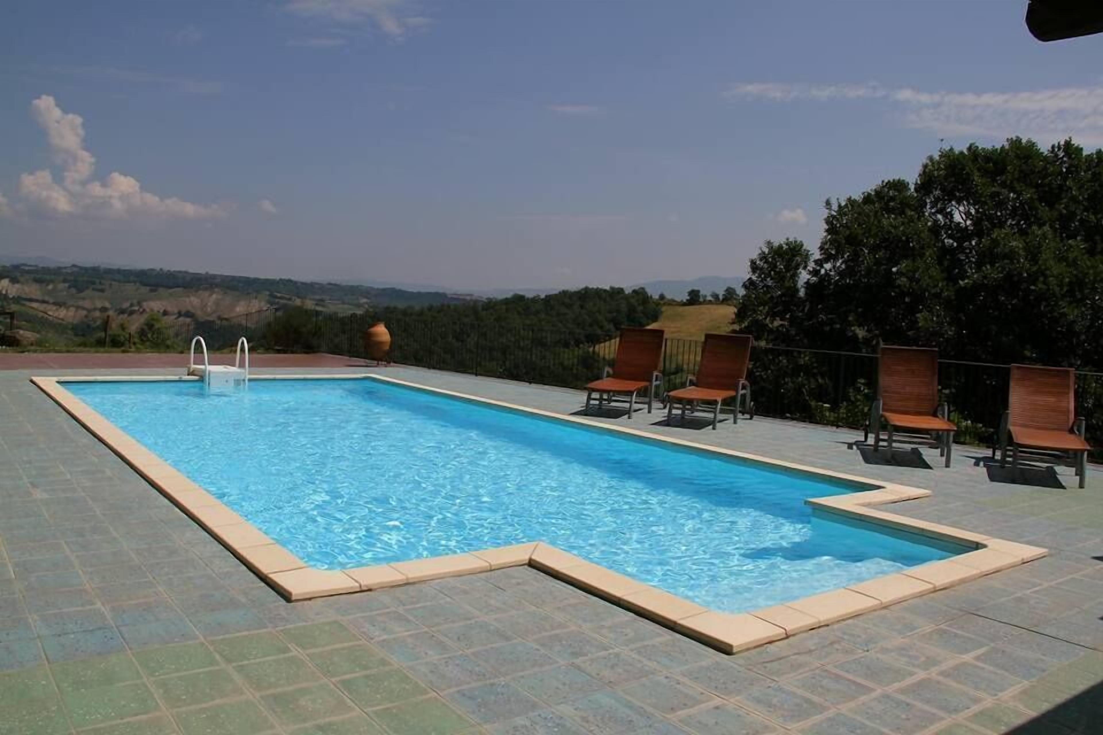 Outdoor pool, open 8:30 AM to 8:00 PM, pool loungers