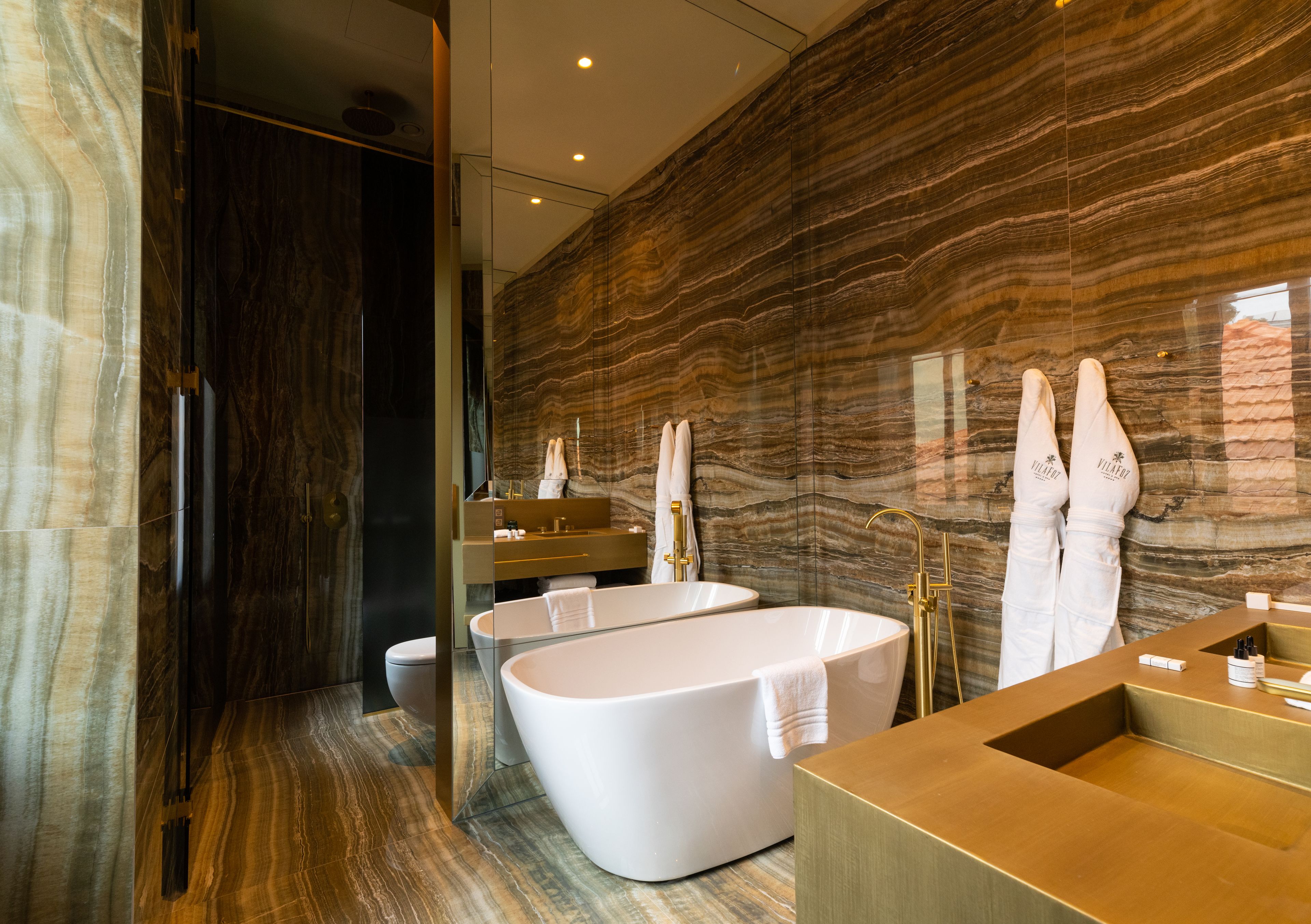 manor house garden suite | bathroom | designer toiletries, hair dryer, bathrobes, slippers