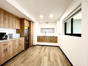 Chambre Quadruple Luxe, vue mer | Cuisine privée