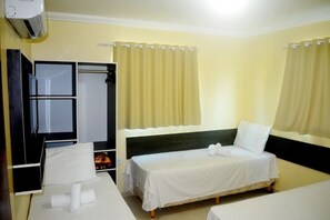 Triple Room | Minibar, blackout curtains, iron/ironing board, free WiFi