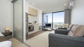 Deluxe Studio with a free secure parking | Private kitchen | Full-sized fridge, microwave, oven, stovetop