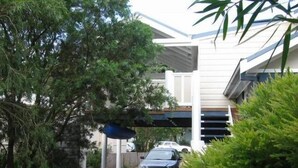 A residential driveway leading to a house with a covered garage. - The Old Boathouse - kayak / high speed internet / minutes to the beach (Burrill Lake)