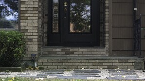 A house with a dark front door, a brick exterior, and a small porch area. - Waterfront Home with Stunning Views .. Dog friendly , and great fishing !!! (Douglas)