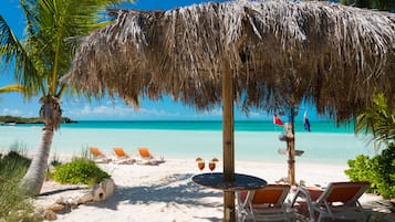 On the beach, sun loungers, beach towels