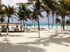Beach nearby, sun-loungers, beach towels - The Condo is in the gated Sirenis Resort community. (Akumal)