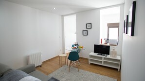 Apartamento, 1 quarto (2) | Área de estar | TV de tela plana