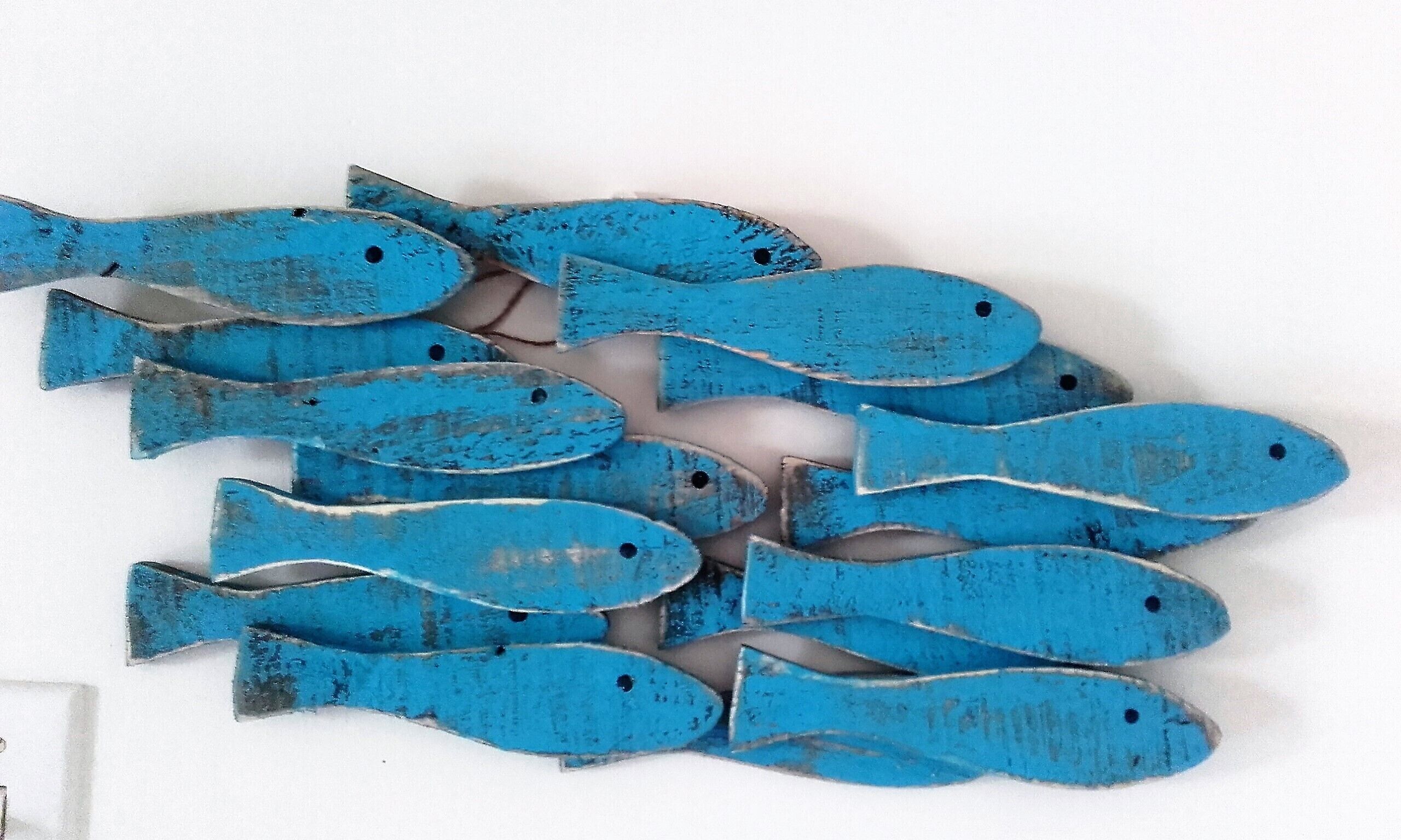 A collection of blue fish-shaped objects.