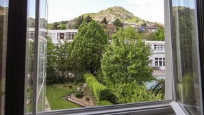 A view from a window overlooking a hillside with trees and buildings. - Classic (Budapest)