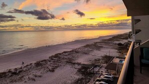 A beach view from a balcony with a clear sky and sunset. - Beautiful direct Gulf view & beach front condo. (Gulf Shores)
